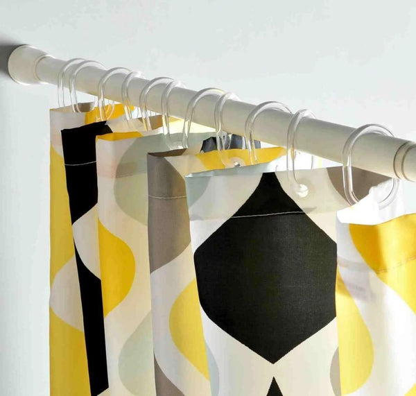 SmartHold™ drill-free expandable curtain rod mounted on a window, showcasing its sleek design and adjustable length.
